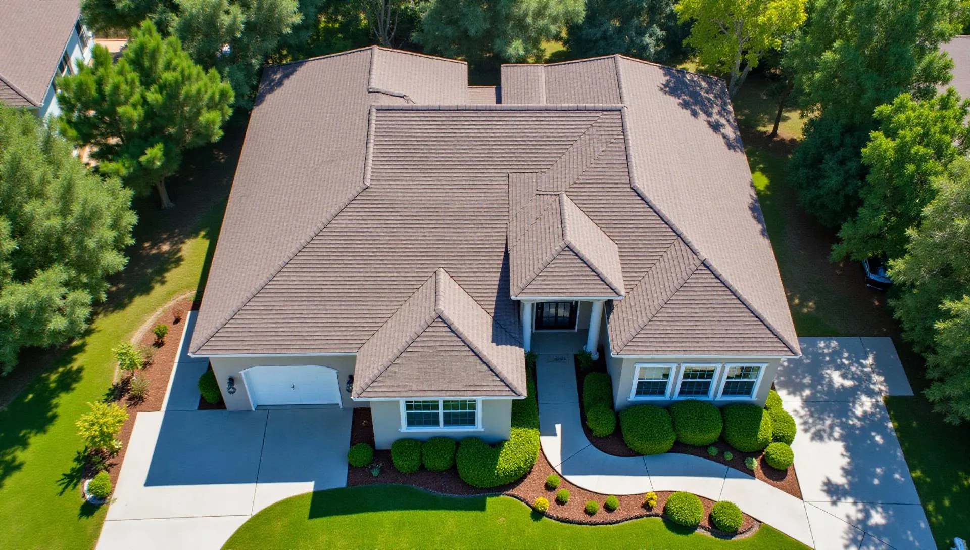 Aerial drone view of professional shingle roof installation by Legend Roofing in Odessa FL